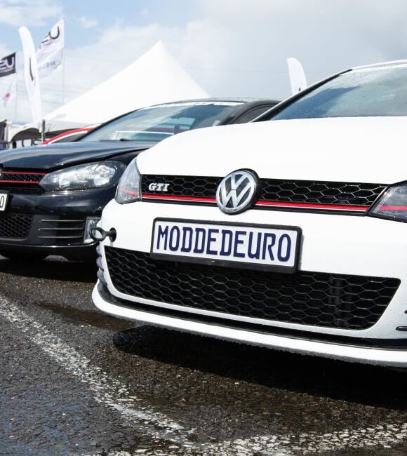 Two Volkswagen Golf cars shown from the front part