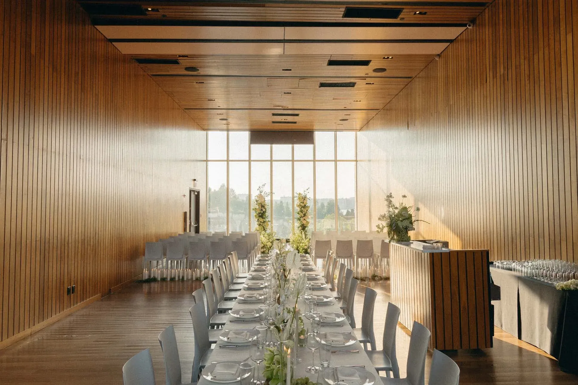 A long table set for dinner in the event space